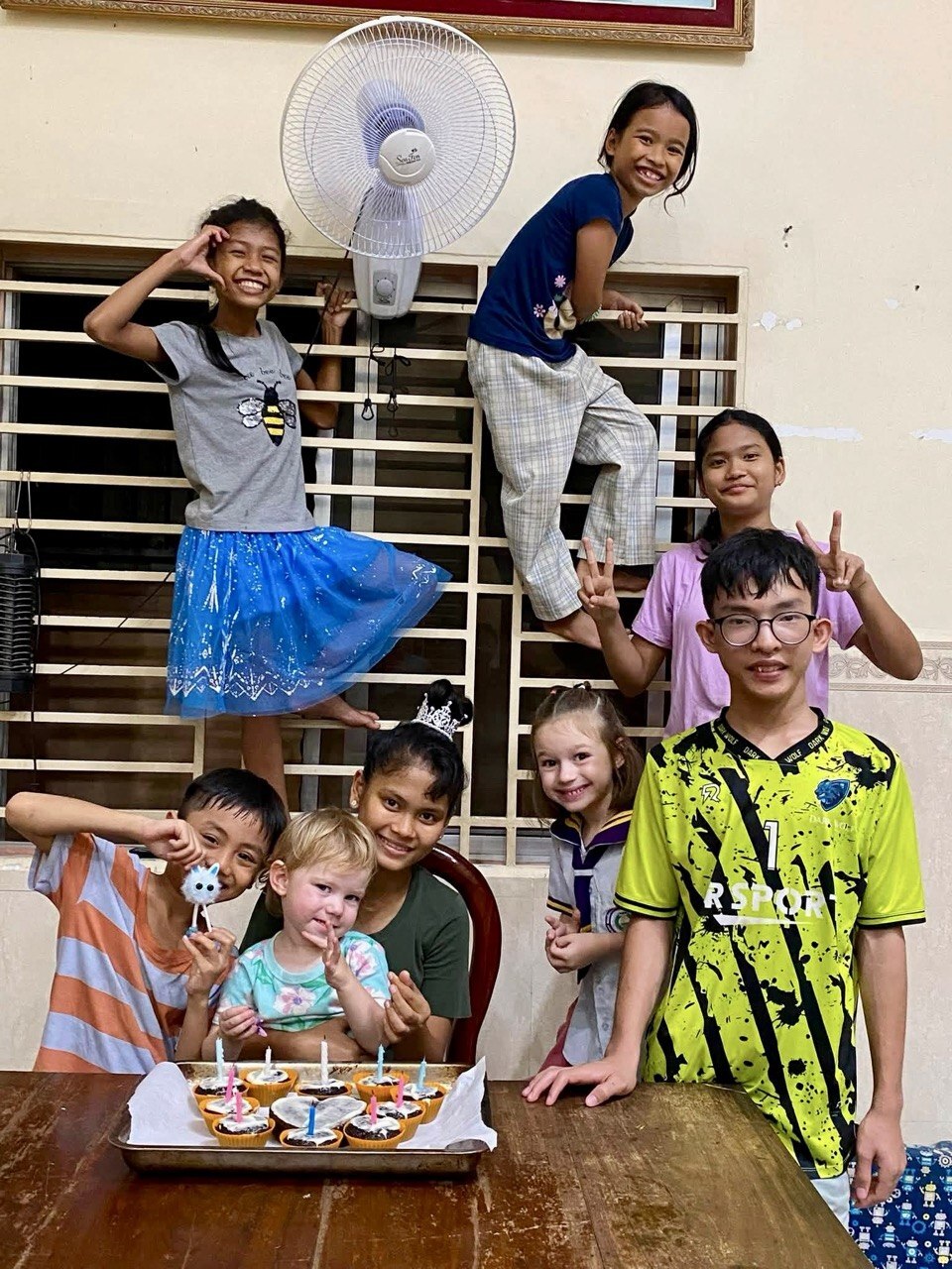 Harlow and Haven celebrating with friends in Cambodia