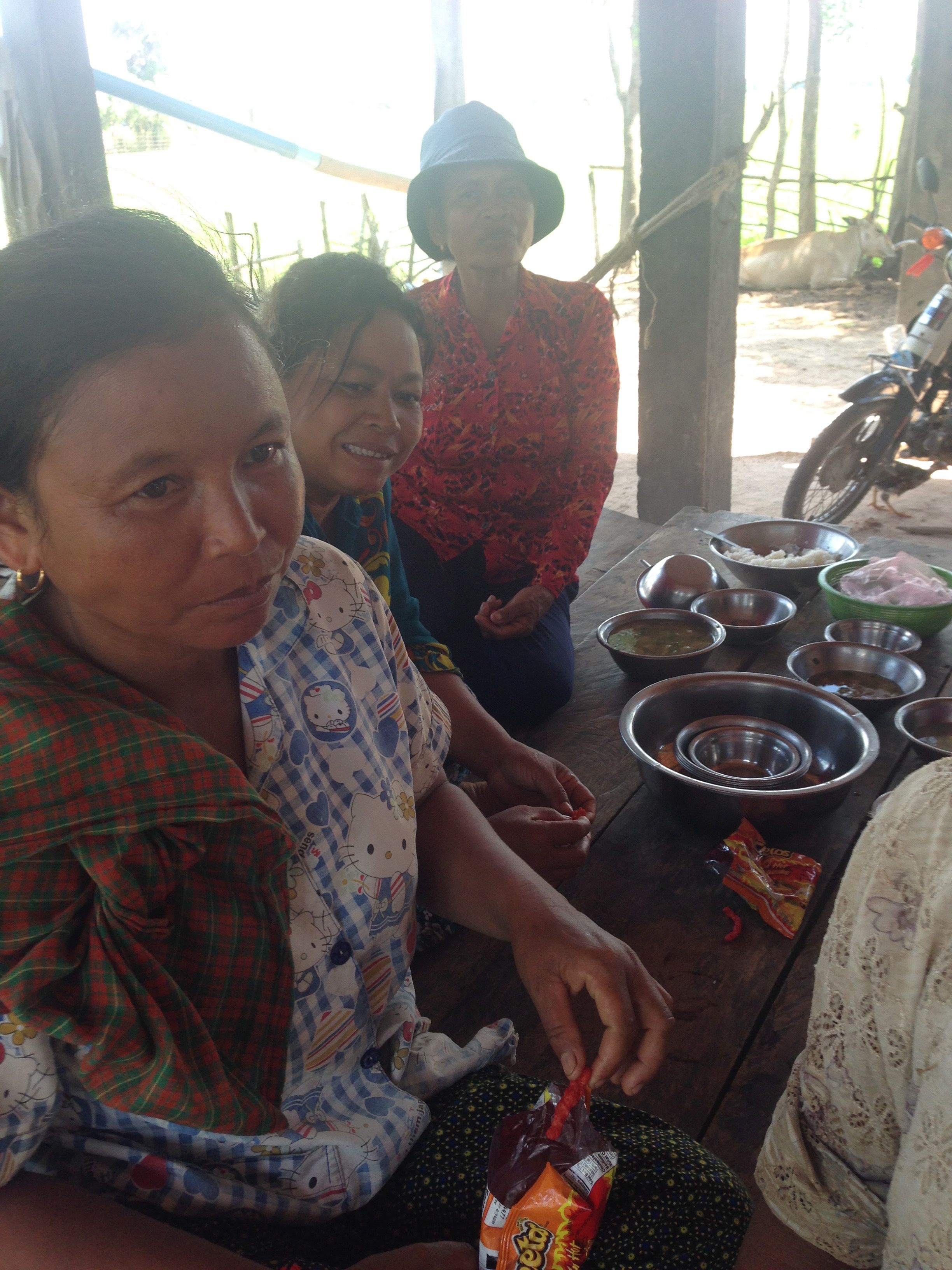 Cambodian pastors sharing Hot Cheetos during fellowship time