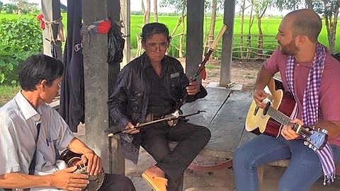Pastor and missionaries playing traditional Khmer music together